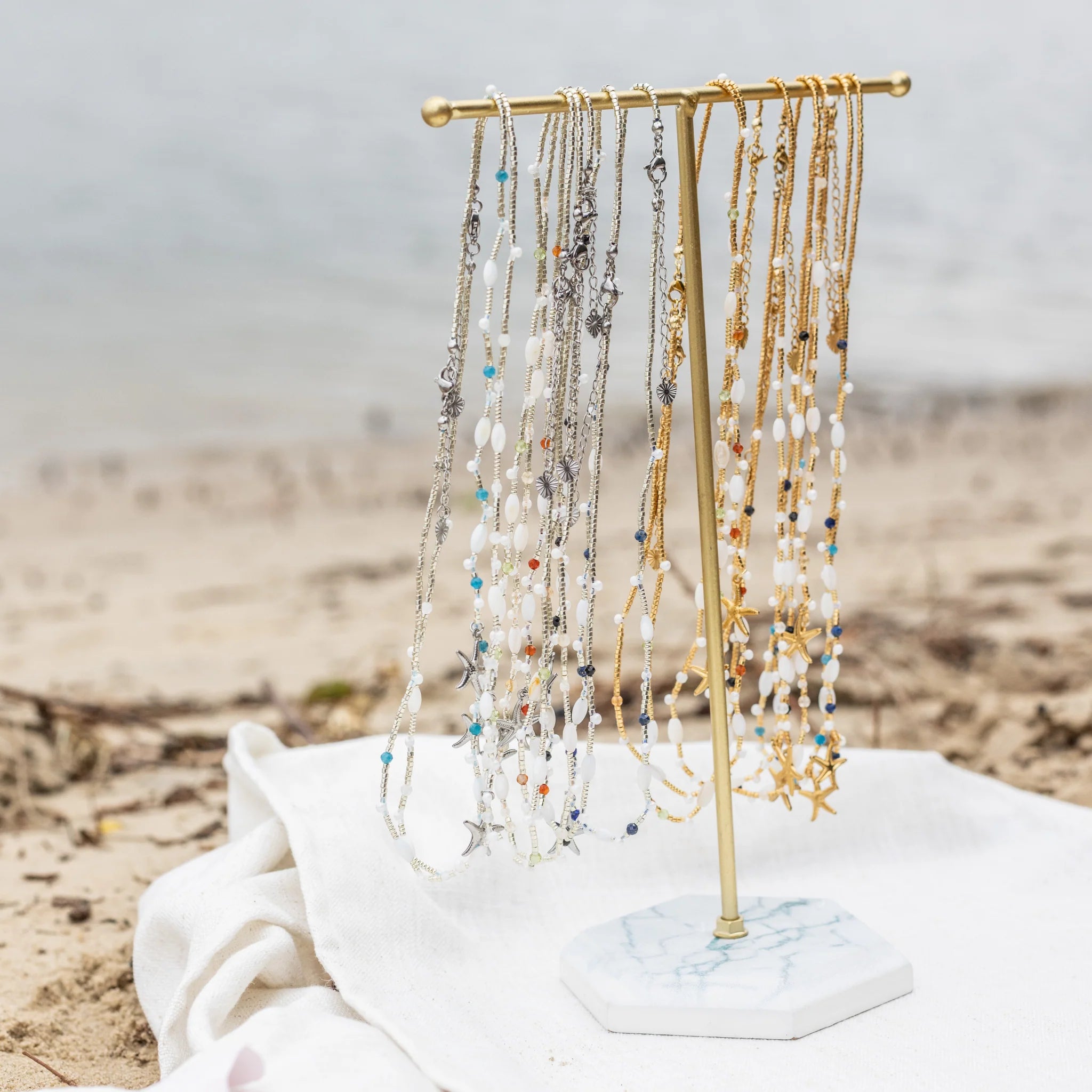 Intuitive Charms beaded necklaces on beach