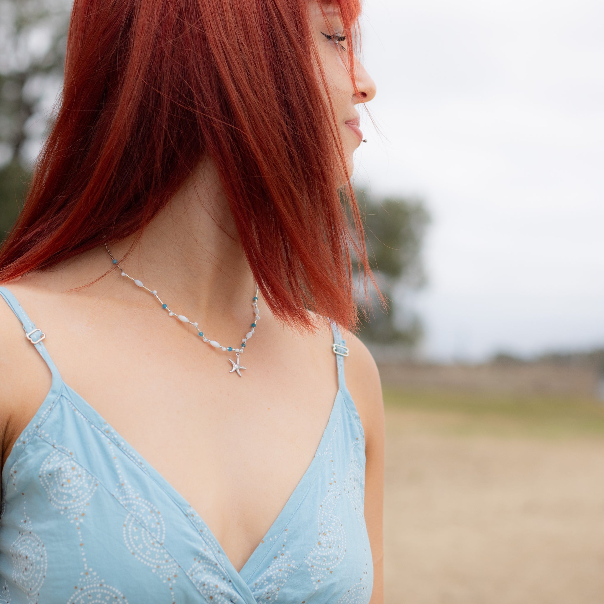 Intuitive Charms Delphina's Song Apatite Braided natural Crystal beaded custom necklace in silver on a model looking away