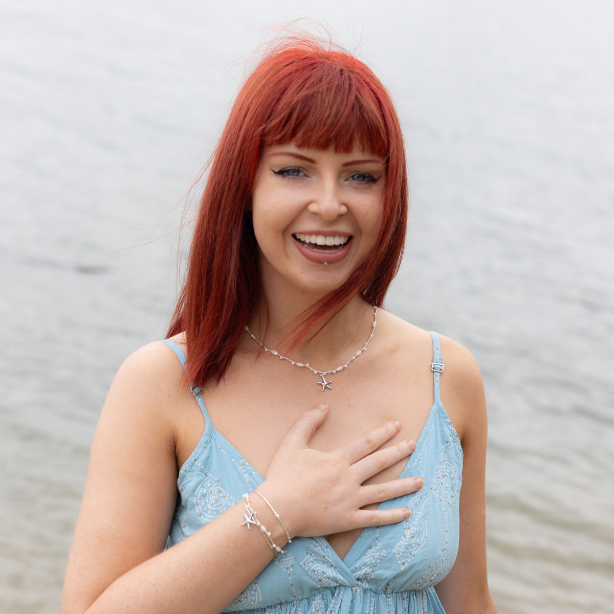 Intuitive Charms Nerina's Song Peridot natural Crystal beaded custom Bracelet in silver on model half body shot and also moonstone