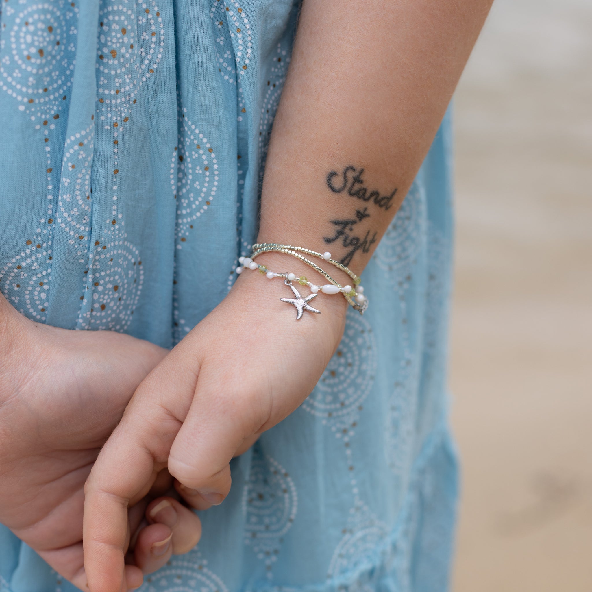 Intuitive Charms Nerina's Song Peridot natural Crystal beaded custom Bracelet in silver on model hand close up