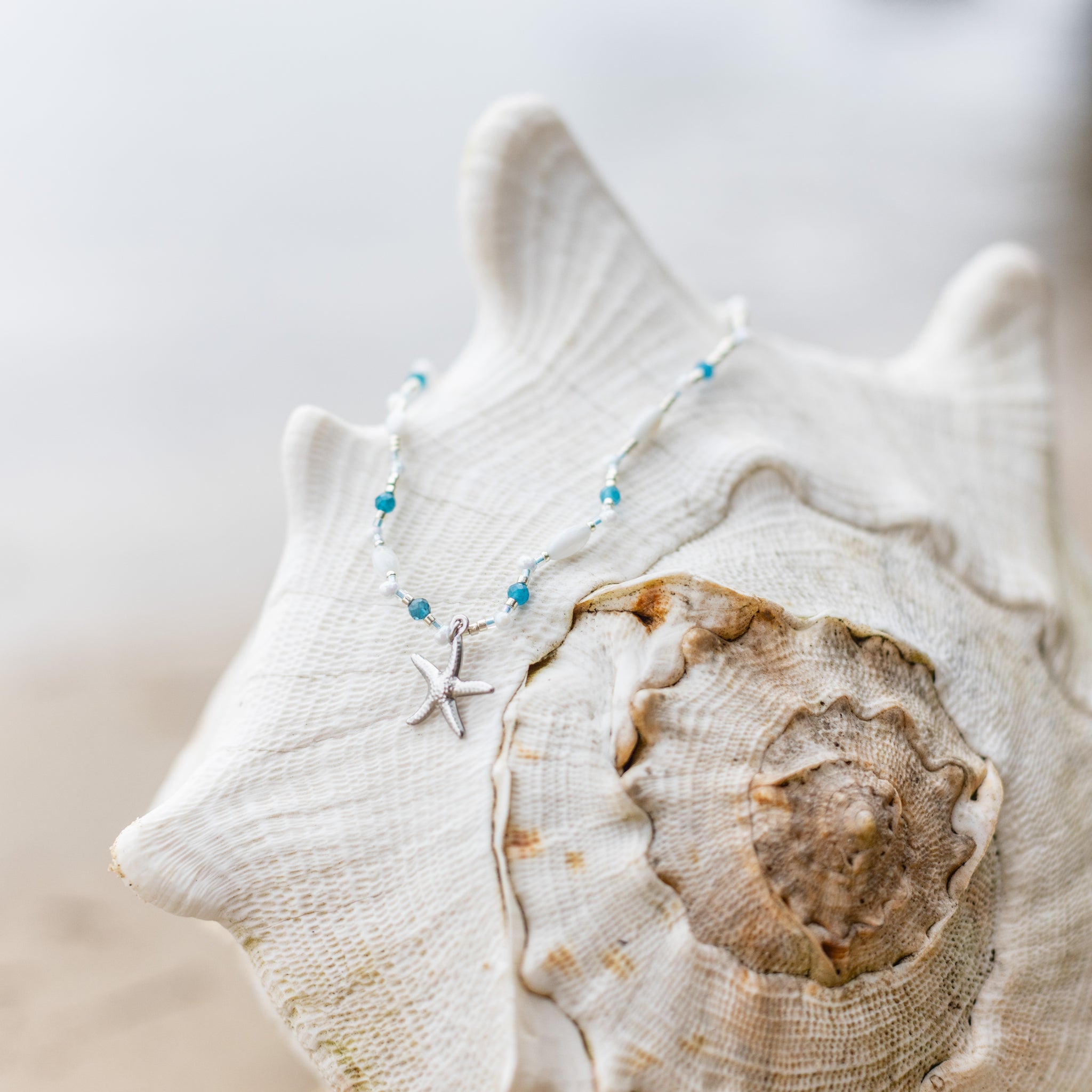 Intuitive Charms Delphina's Song Apatite Braided natural Crystal beaded custom necklace in silver on a shell